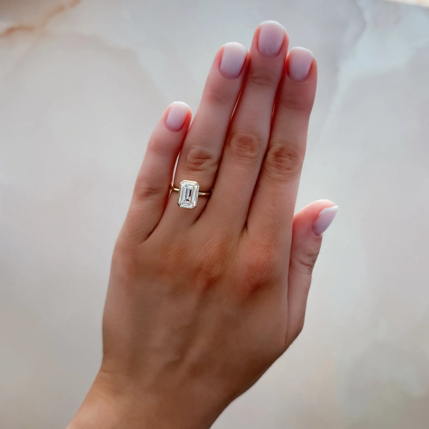 Penumbra Bezel Set Engagement Ring With Emerald Cut - Image 3