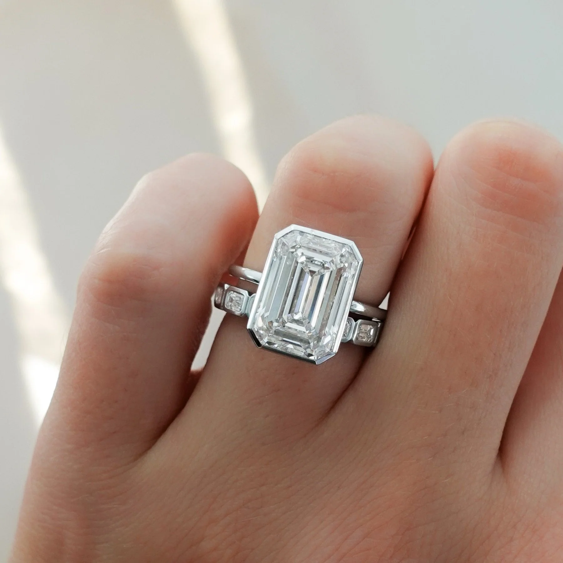 Penumbra Bezel Set Engagement Ring With Emerald Cut - Image 9