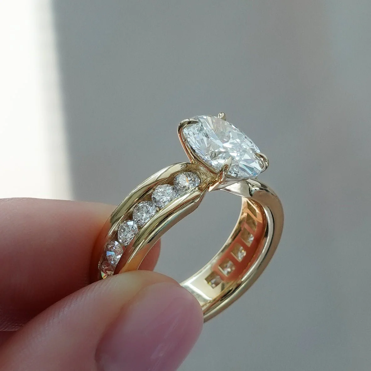 Chunky Channel Set Engagement Ring with Oval Cut Diamond - Image 10