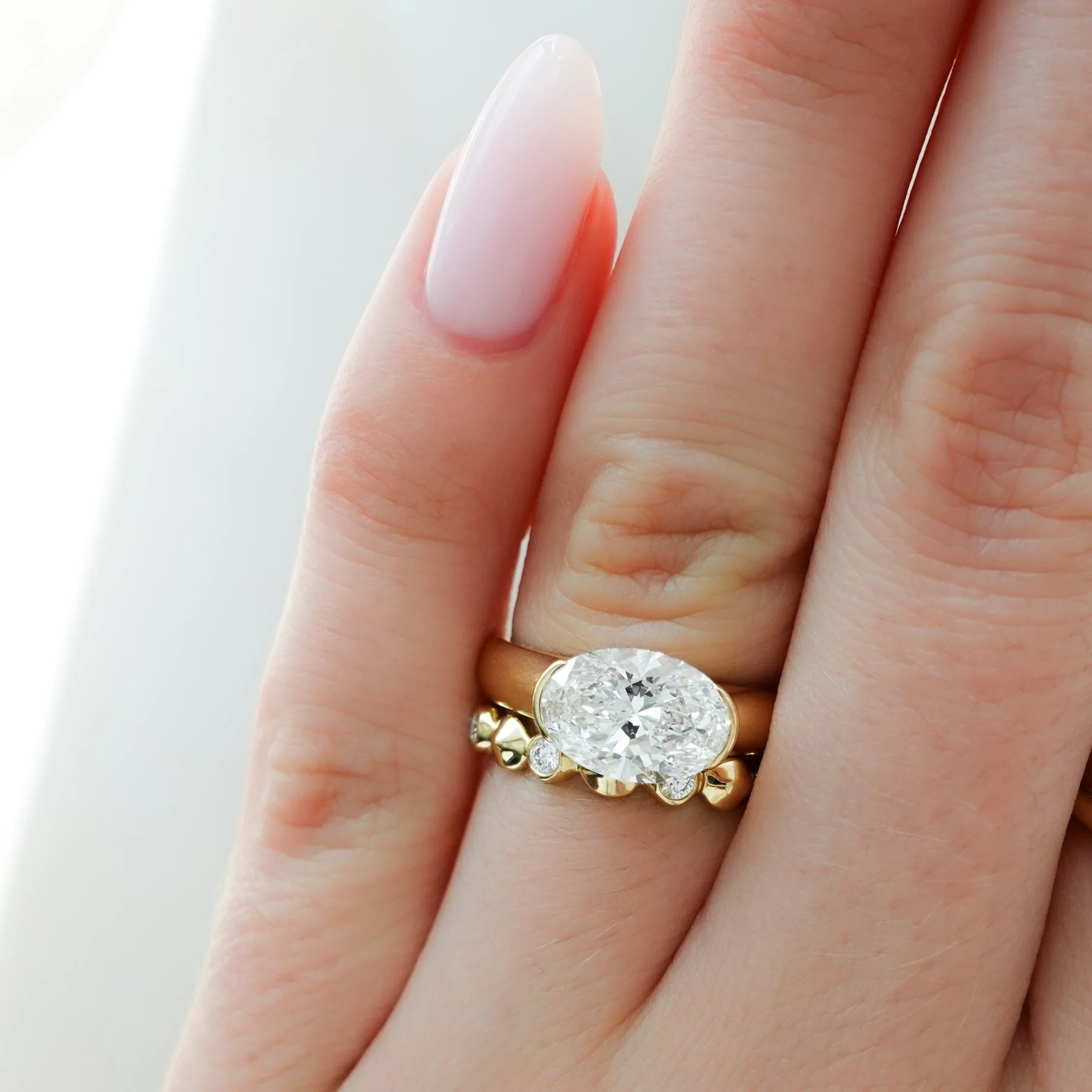 East West Half Bezel 4mm Solitaire Engagement Ring With Oval Cut Diamond - Image 7