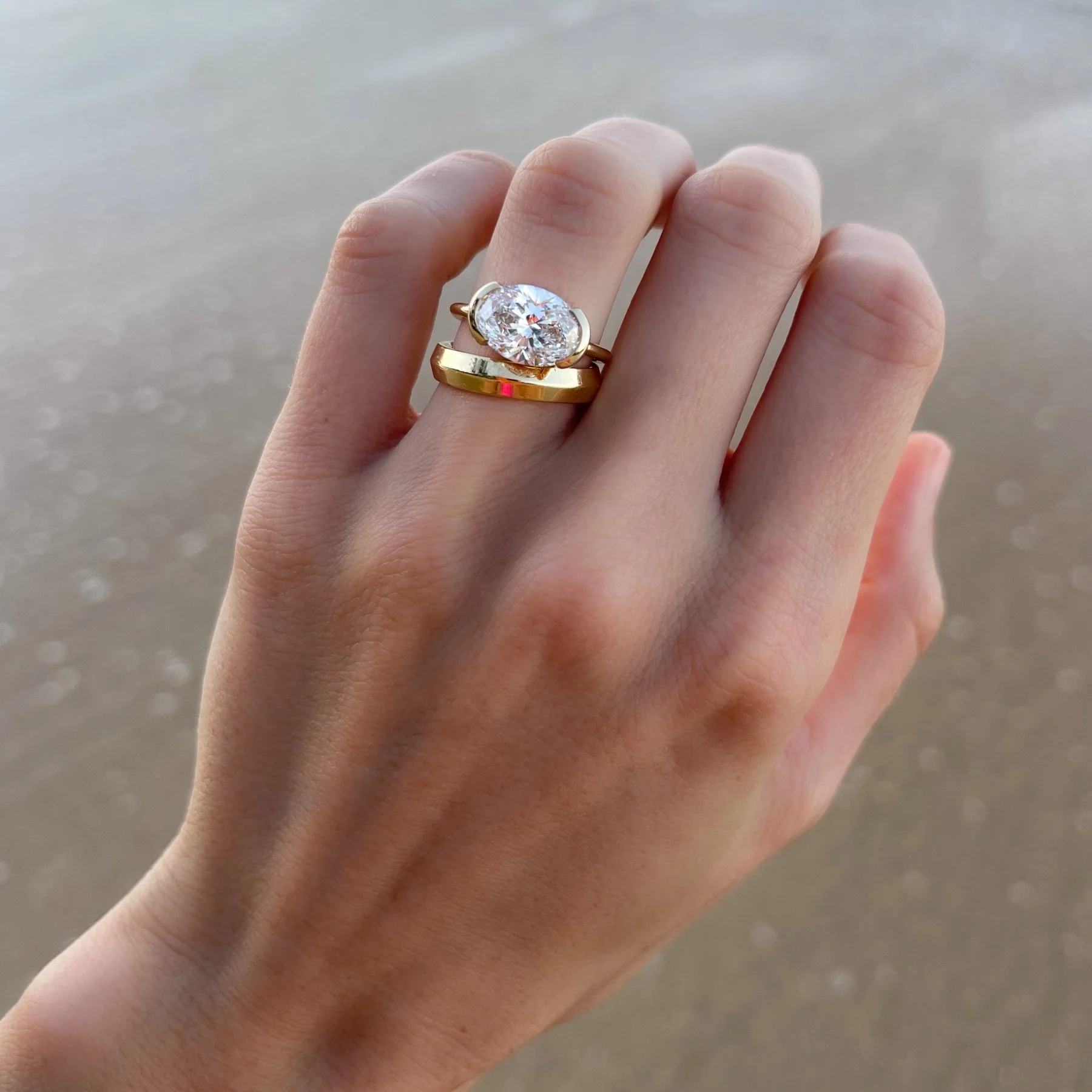 East West Half Bezel Solitaire Engagement Ring With Oval Cut Diamond - Image 8