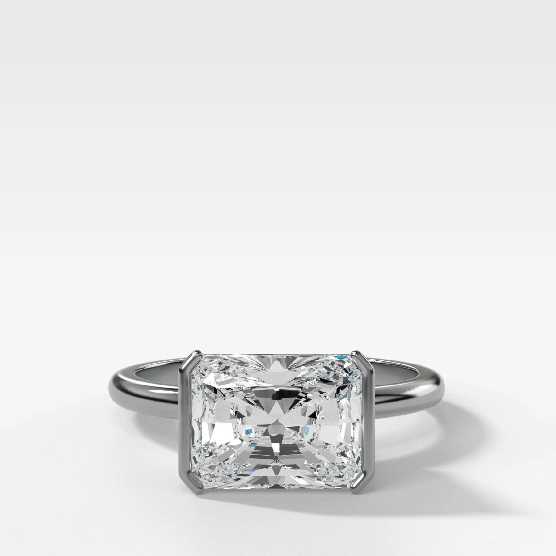 East West Half Bezel Solitaire Engagement Ring With Elongated Radiant Cut Diamond - Image 4