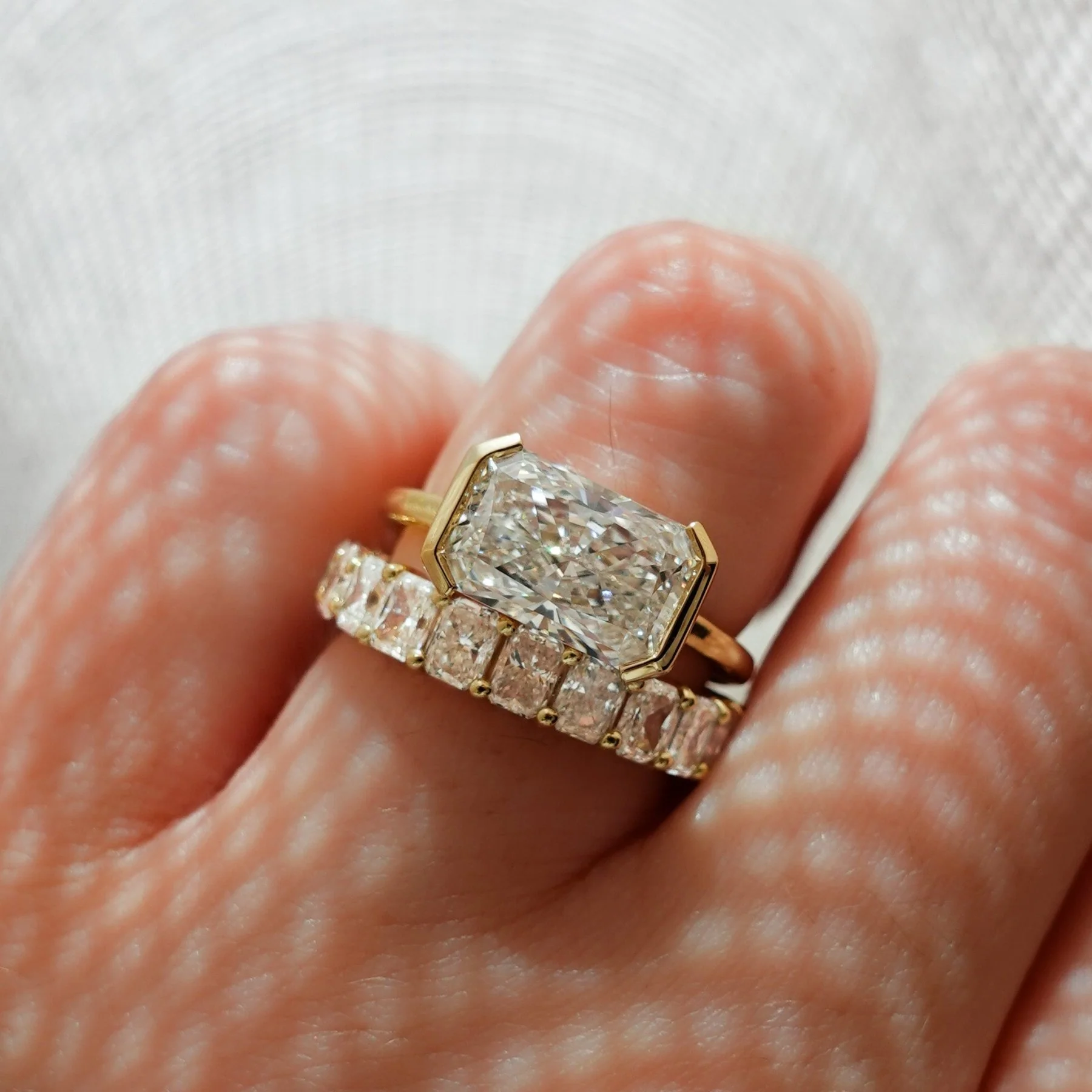 East West Half Bezel Solitaire Engagement Ring With Elongated Radiant Cut Diamond - Image 6