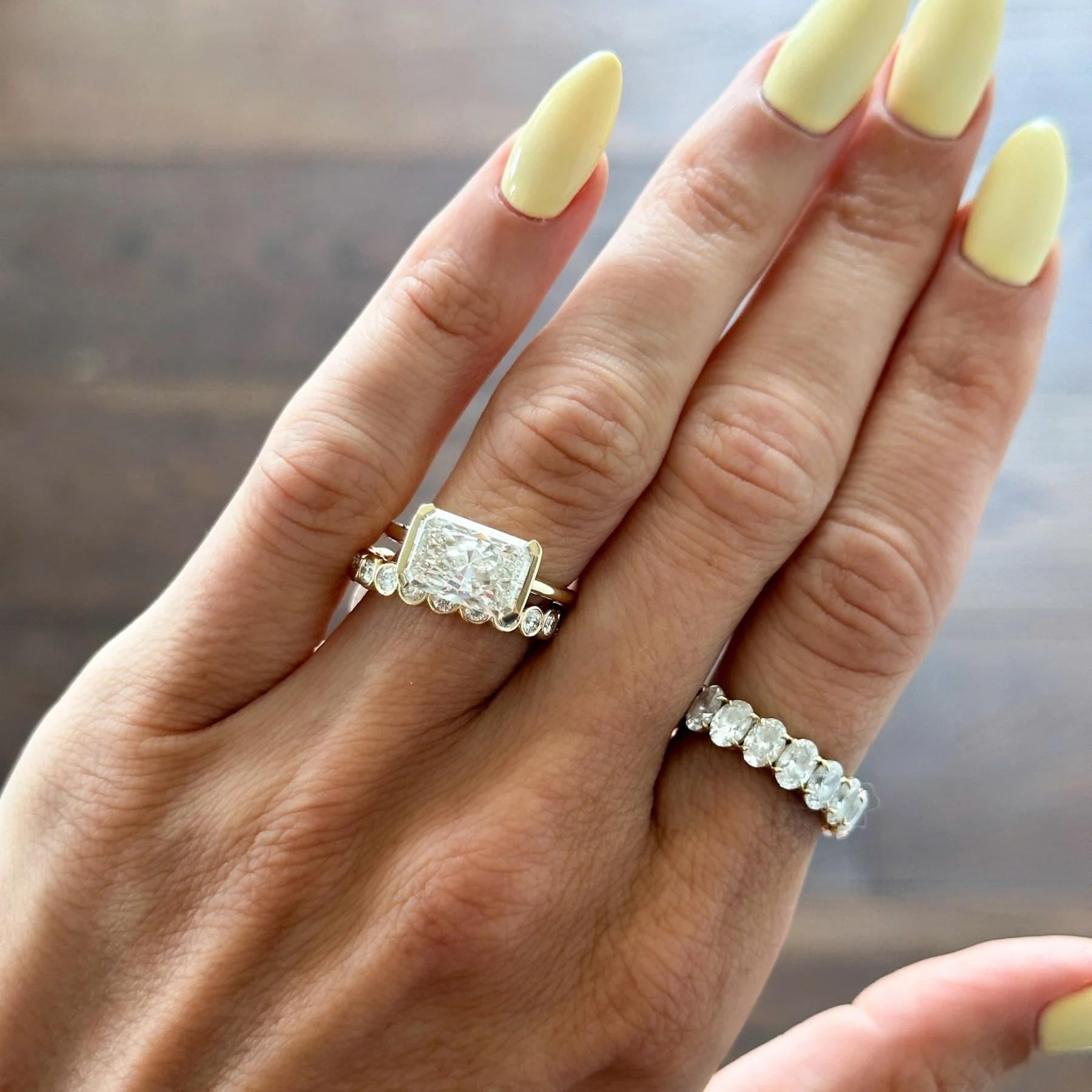 East West Half Bezel Solitaire Engagement Ring With Elongated Radiant Cut Diamond - Image 8