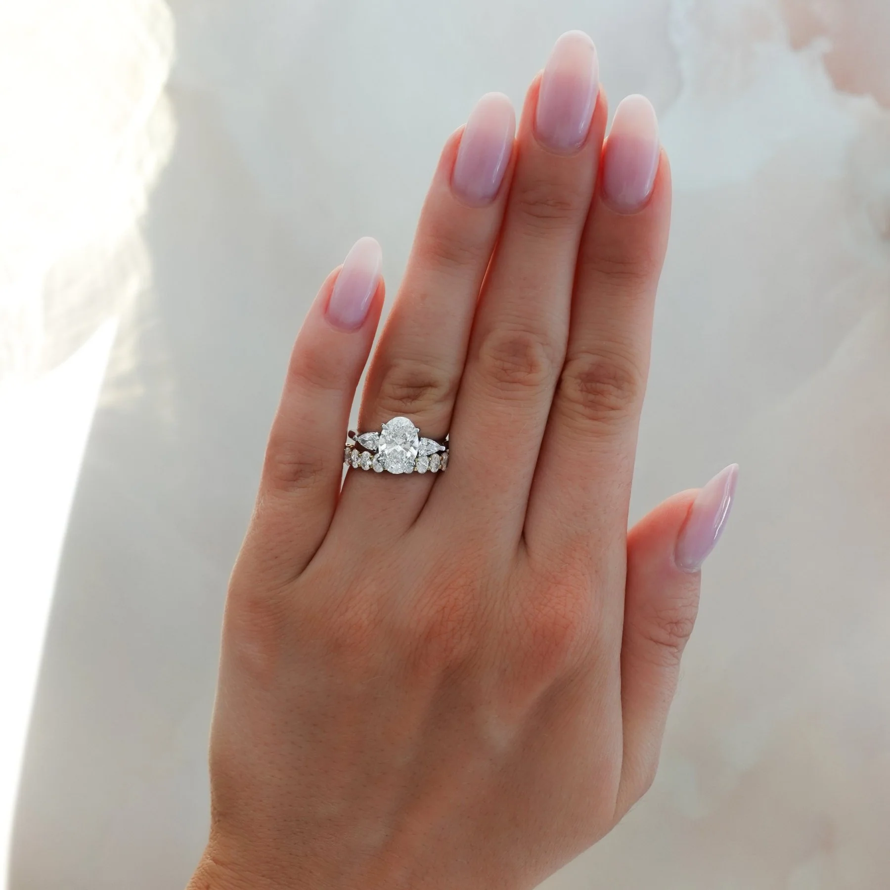 Three Stone Engagement Ring With Pear Side Stones and Oval Cut Diamond - Image 6